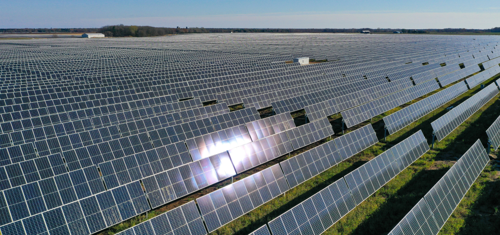 Sun shines on the solar panels at the Two Creeks Solar Park.