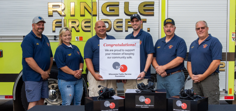 A photo of the Ringle Fire Department after receiving a 2021 Rewarding Responders Grant.
