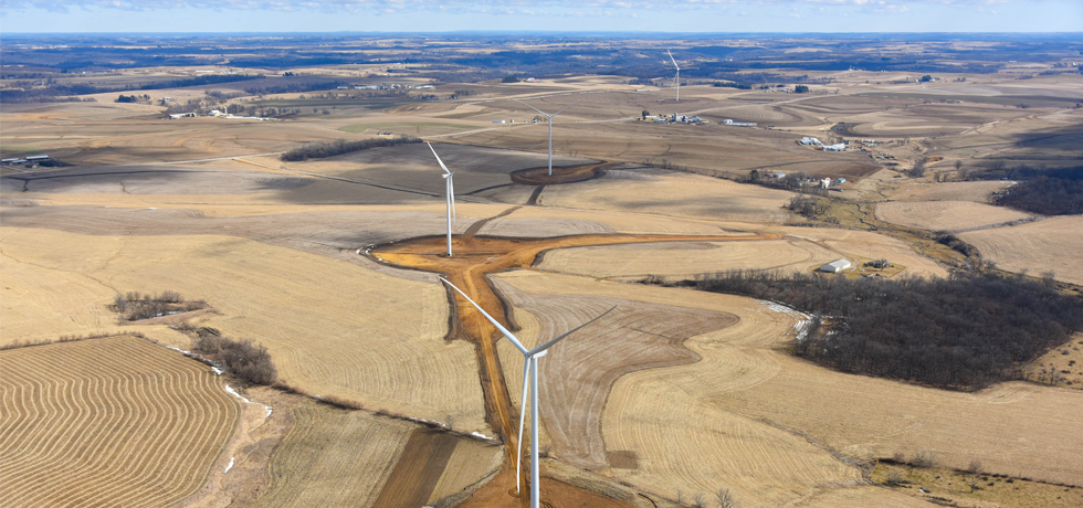 An overhead view of four wind turbines installed on rural fields in Wisconsin.