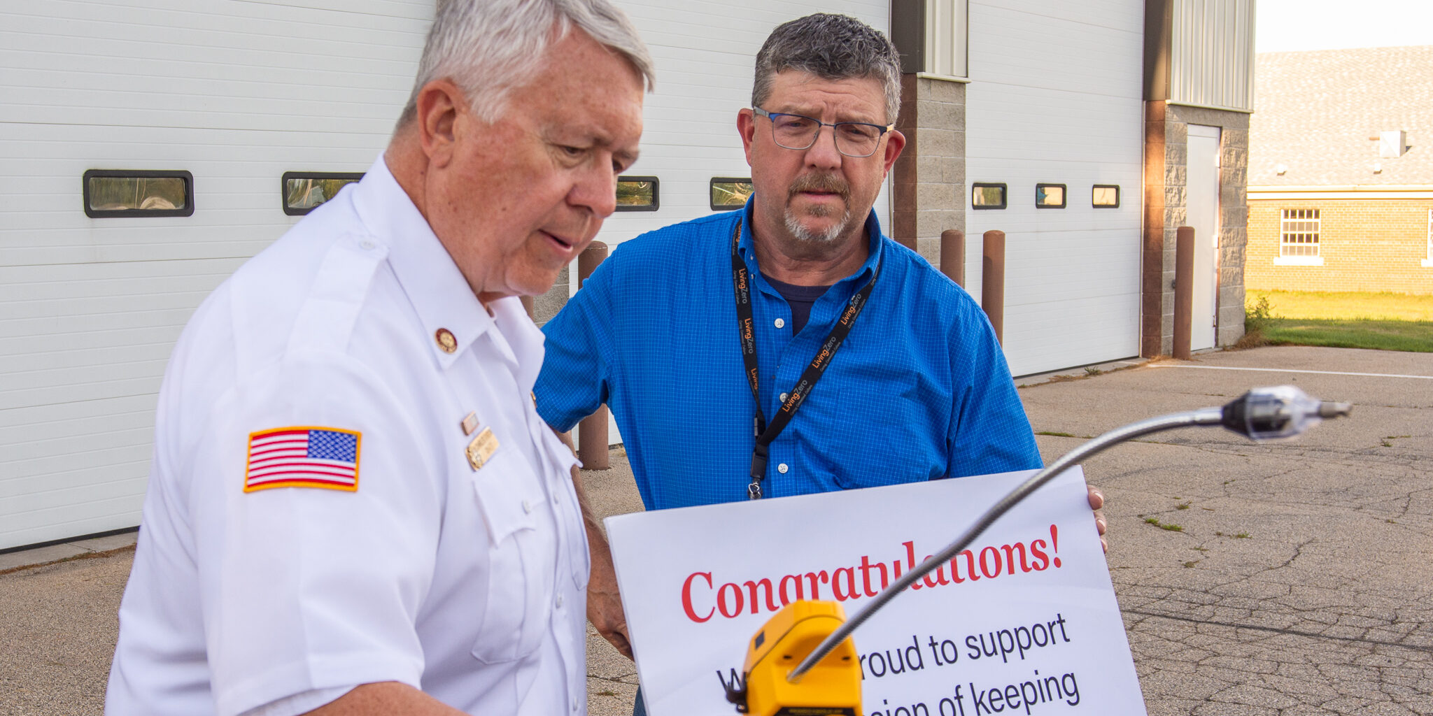 A WPS employee watches the City of Peshtigo Fire Department's fire chief explain how a new multi-gas detector is used.